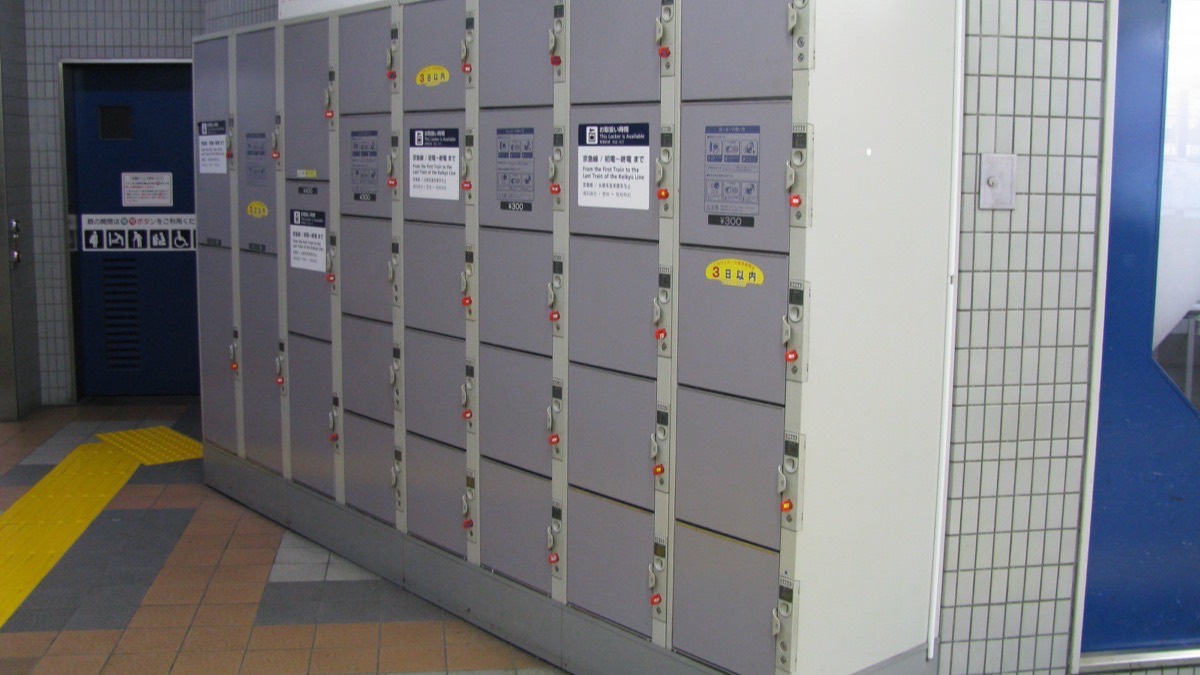 A bank of coin lockers inside a Japanese train station
